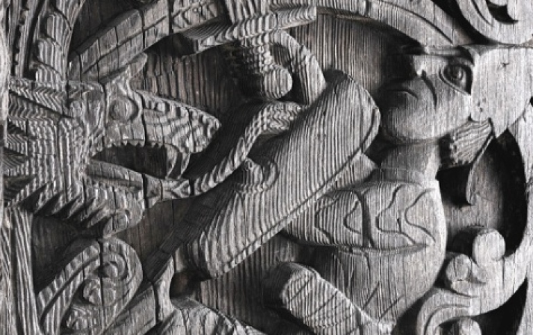 Cover thesis with a picture of old carved wooden church portal.
